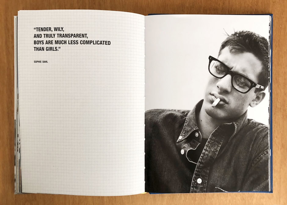 Black and white portrait of a young man wearing sunglasses and a denim jacket with a cigarette in his mouth, captured in a candid, high-contrast photography style by Pamela Hanson Photography.
