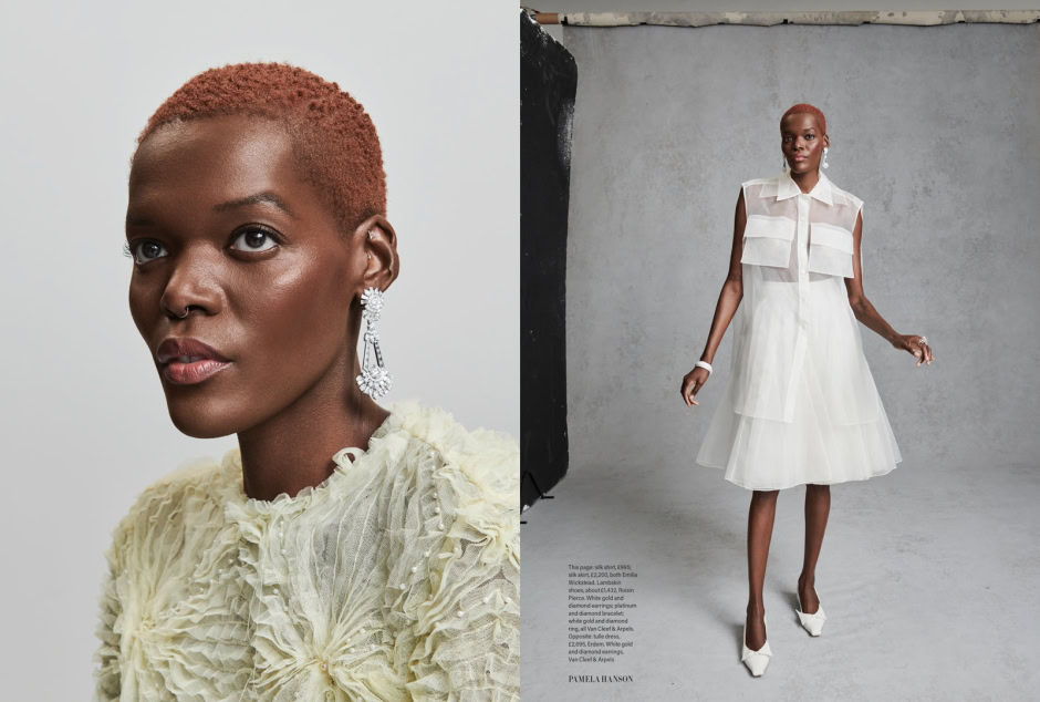 Elegant African American woman with short red hair wearing white feathered dress, jewelry, and earrings; high fashion portrait.