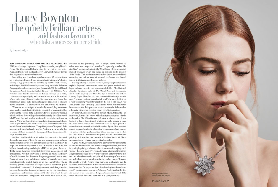 Lucy Boynton portrait photography showcasing elegance and style, featuring a close-up of a woman with auburn hair, diamond jewelry, and a sophisticated pose.