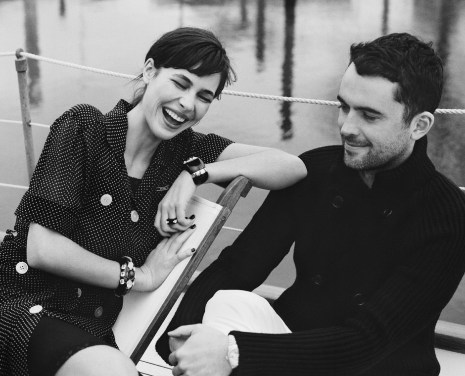 Genuine candid portrait of a smiling woman laughing with a man, captured by Pamela Hanson Photography, showcasing natural joy and authentic emotional connection.